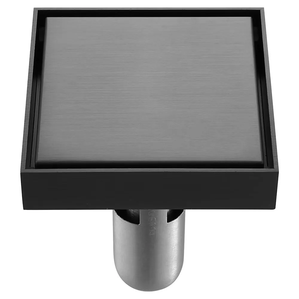 Square point floor drain flush with small-format shower tiles